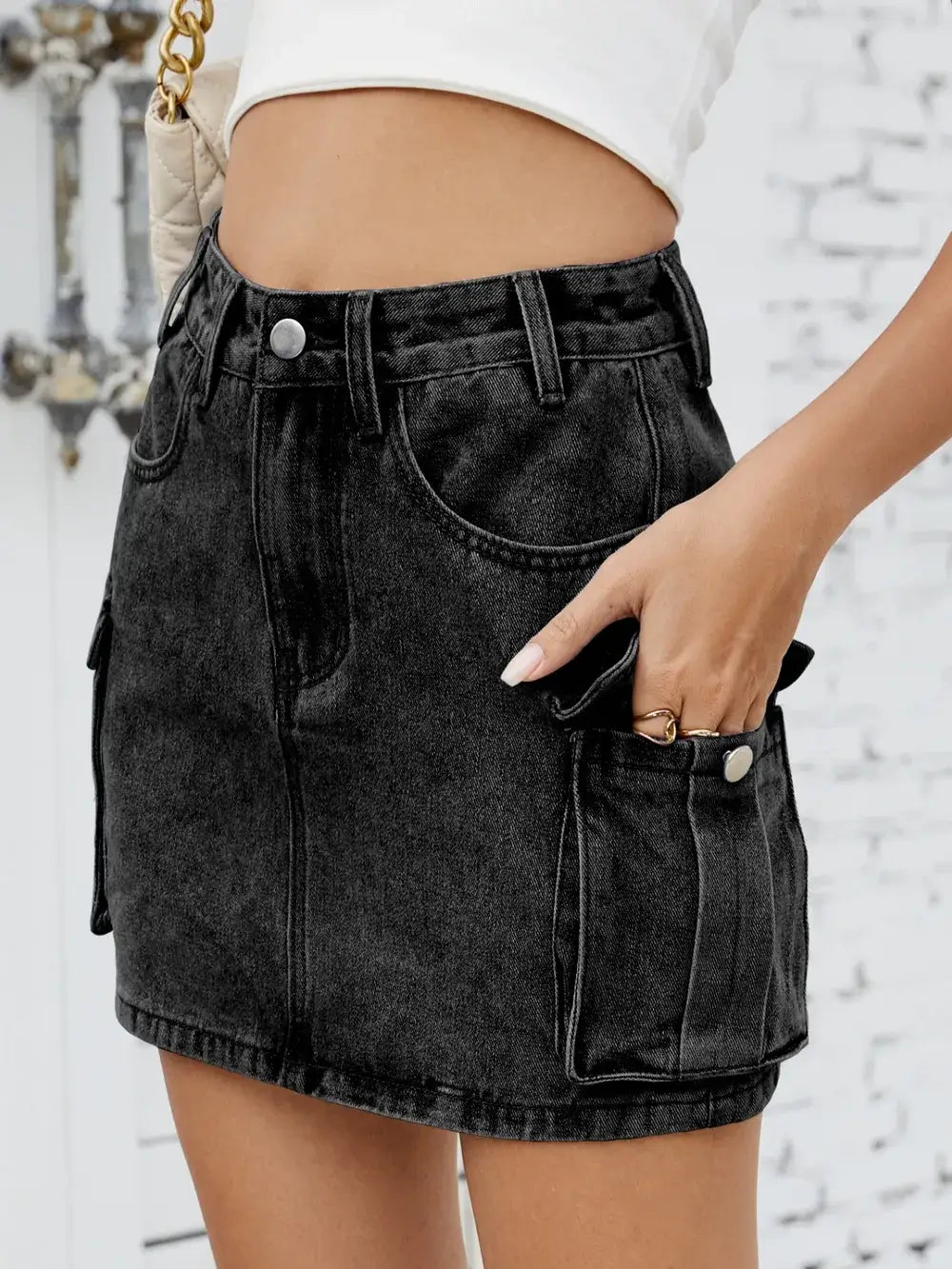 Cargo denim skirt for women, featuring functional pockets and a stylish cut, perfect for casual and trendy outfits.