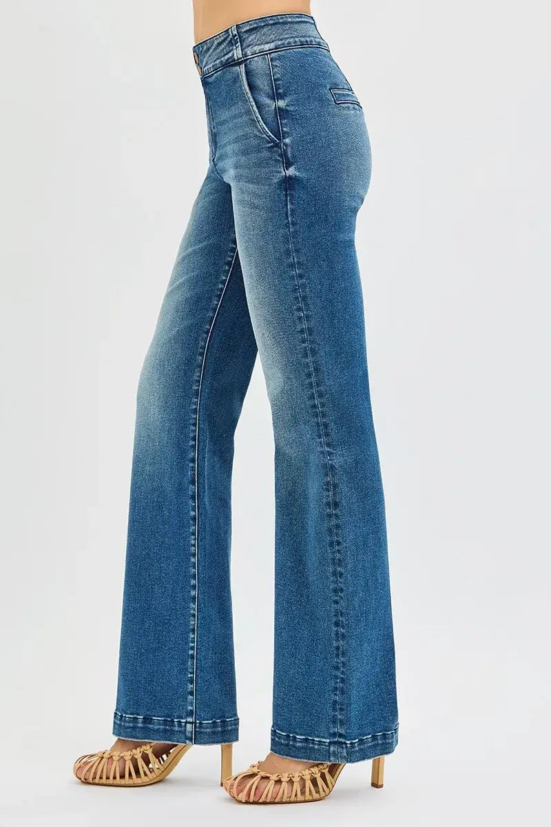 Side view of RISEN High Rise Bootcut Plus Size Jeans with double button waistband and retro-inspired charm.