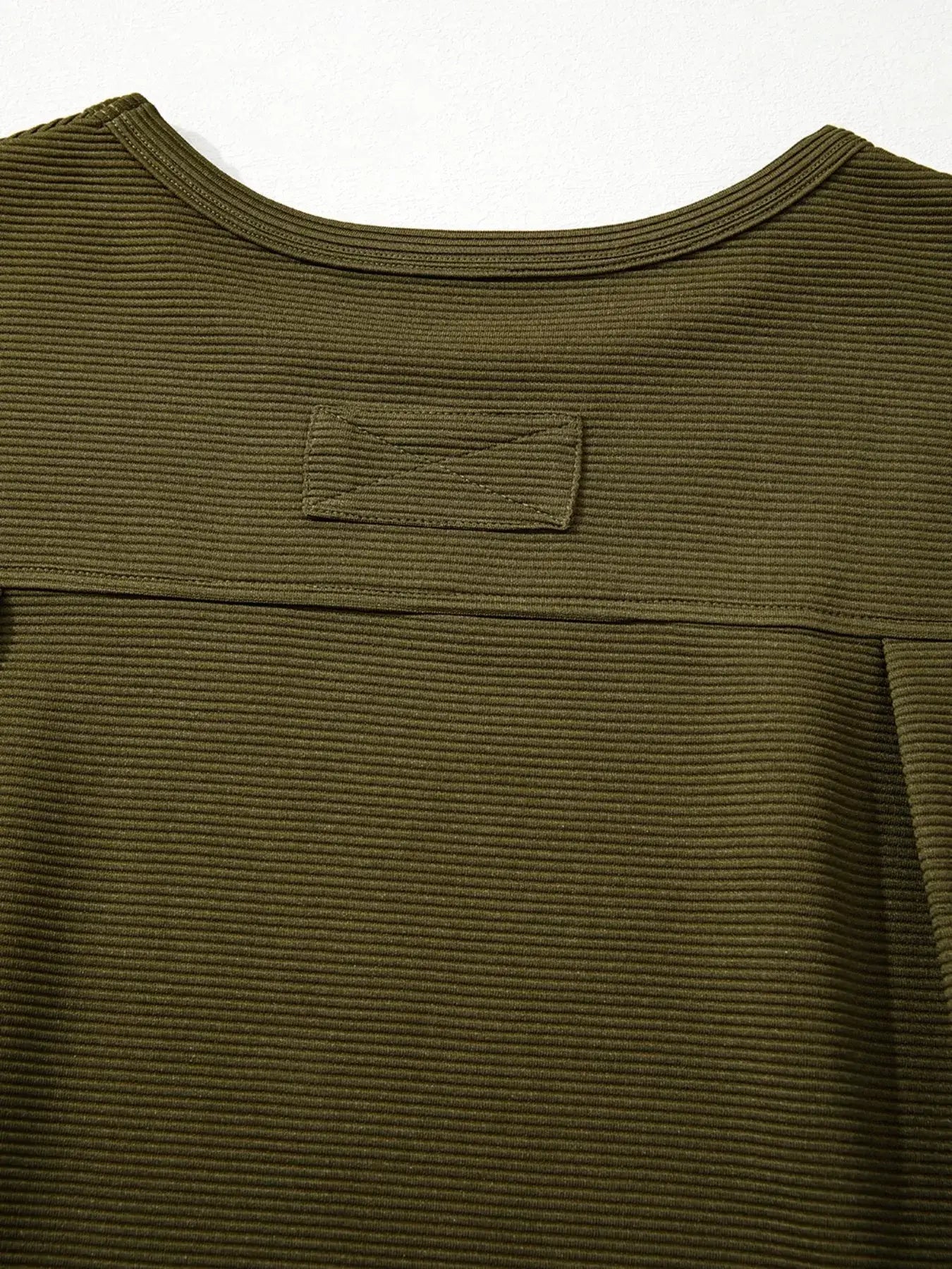 Back view of the Ribbed Knit Oversized Sweatshirt showcasing its textured fabric and relaxed fit.