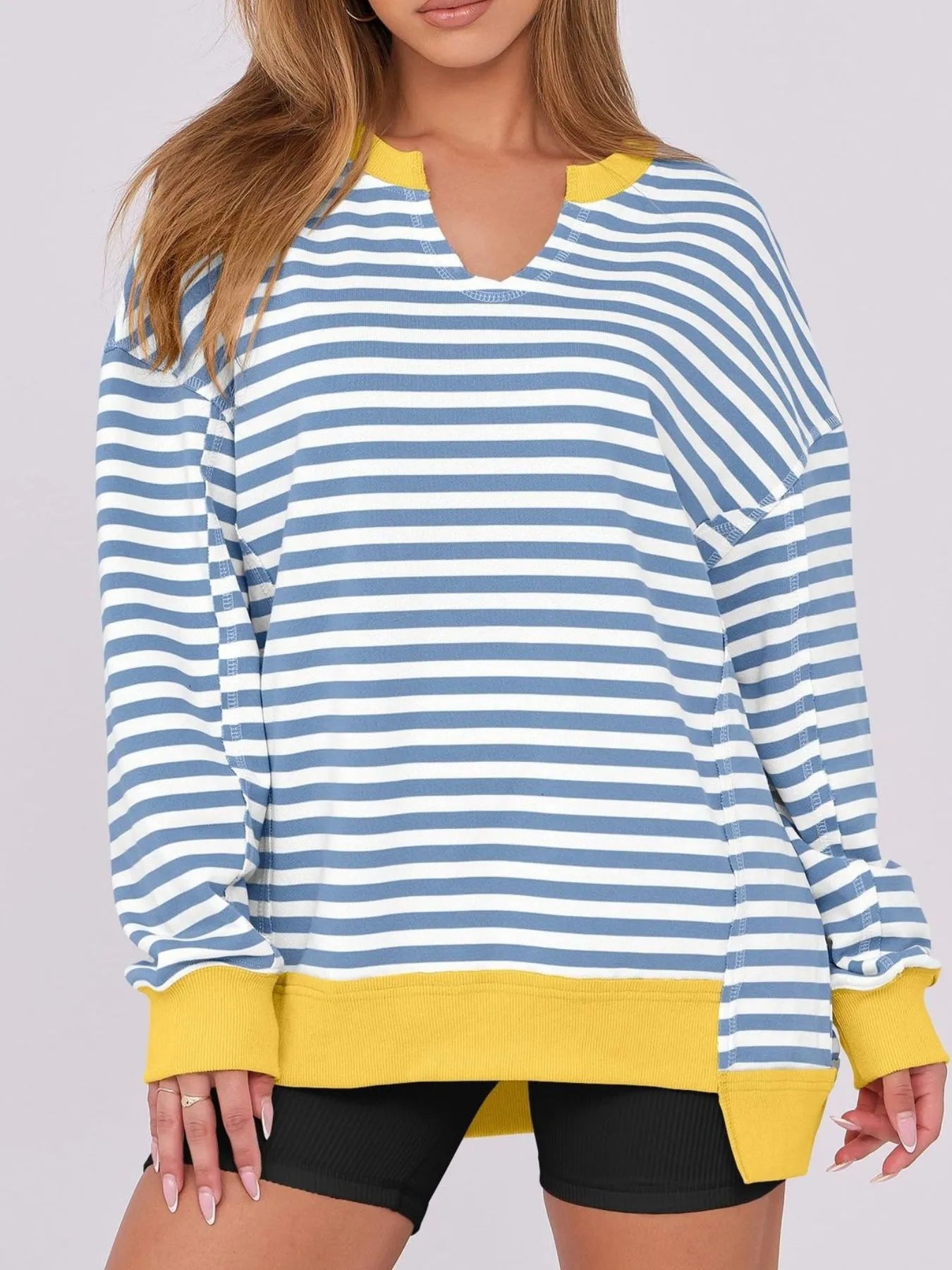 Notched Long Sleeve Oversized Sweatshirt in blue and white stripes with yellow accents, perfect for casual wear.