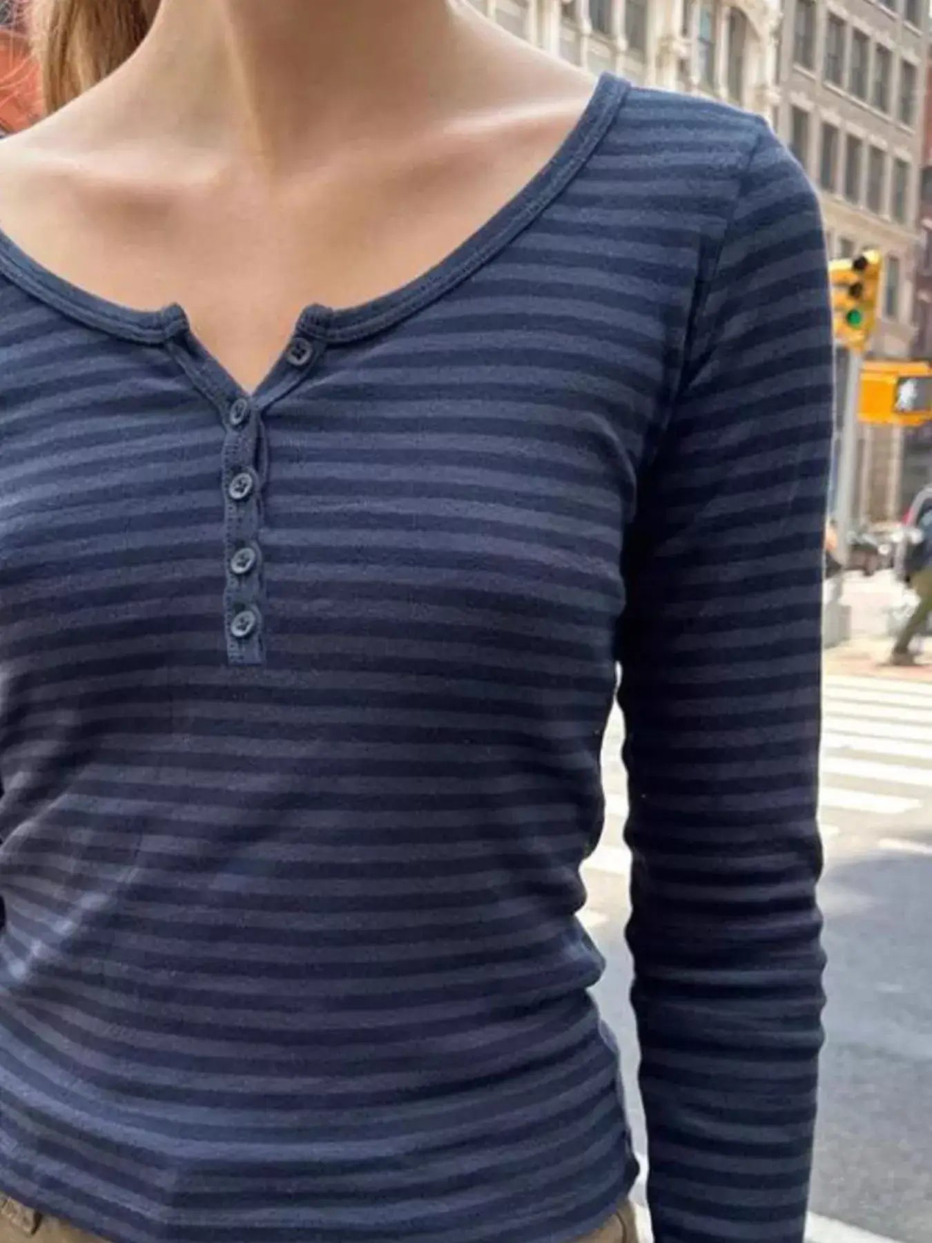 Striped long sleeve Henley t-shirt featuring buttoned design in navy and gray, ideal for casual wear.
