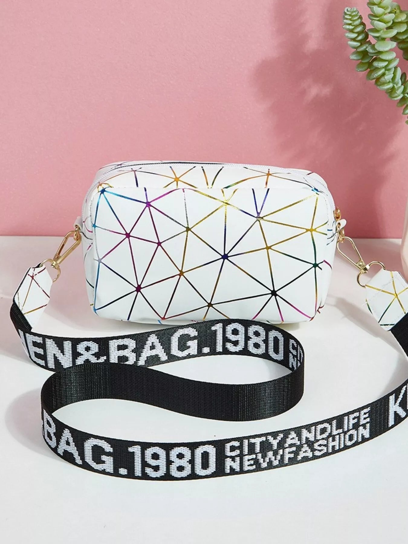 Geometric Pattern Crossbody Bag featuring a mini size design with a stylish strap and colorful geometric accents.