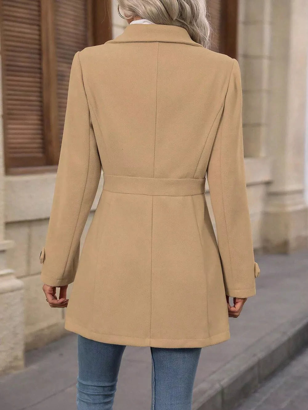 Back view of a Collared Neck Button Up Coat in beige, showcasing the belted design and classic silhouette.