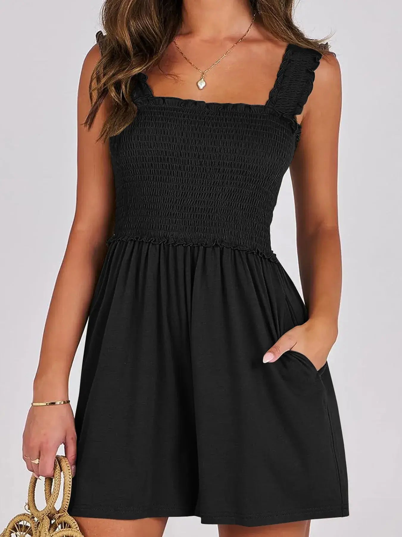 Smocked Square Neck Summer Romper in black with a smocked bodice, square neckline, and ruffled edges.