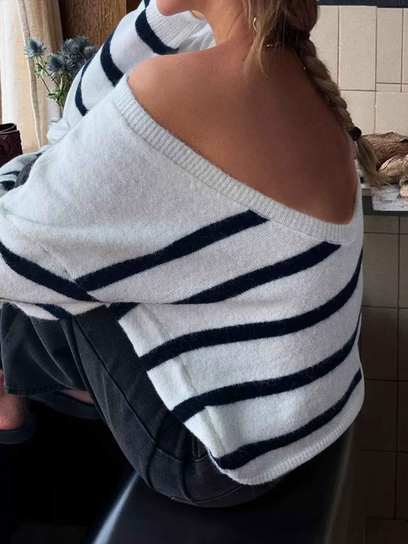 Striped round neck long sleeve knit top featuring an off-shoulder design and relaxed fit, perfect for casual chic outfits.