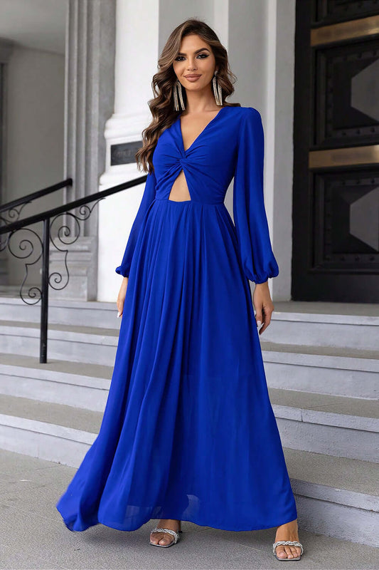 Twist Front Cutout Long Sleeve Dress model in blue standing on stairs, showcasing elegant evening outfit.
