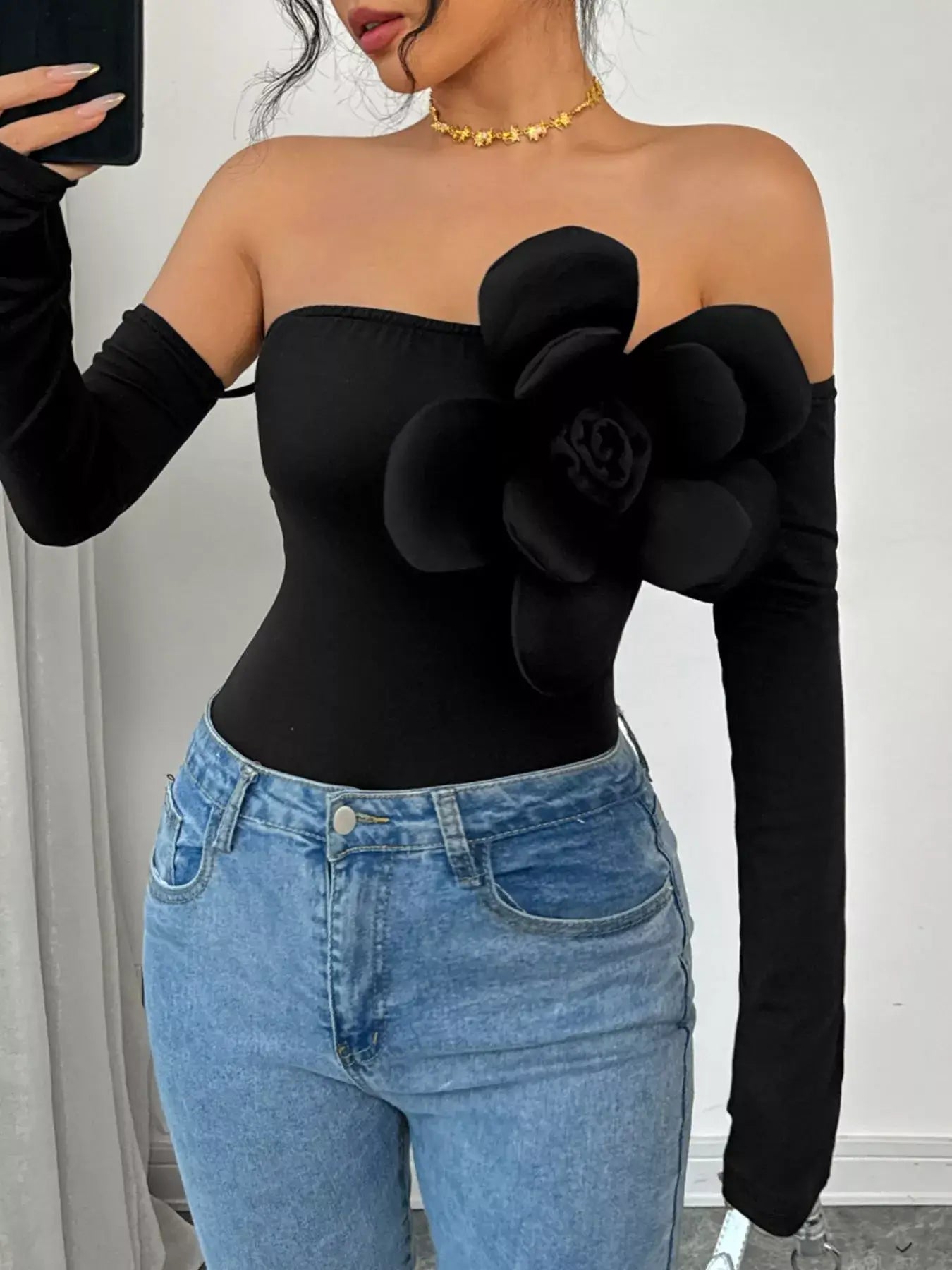 Flower Off-Shoulder Long Sleeve Bodysuit with Floral Detail in Black, Perfect for Chic Outfits.