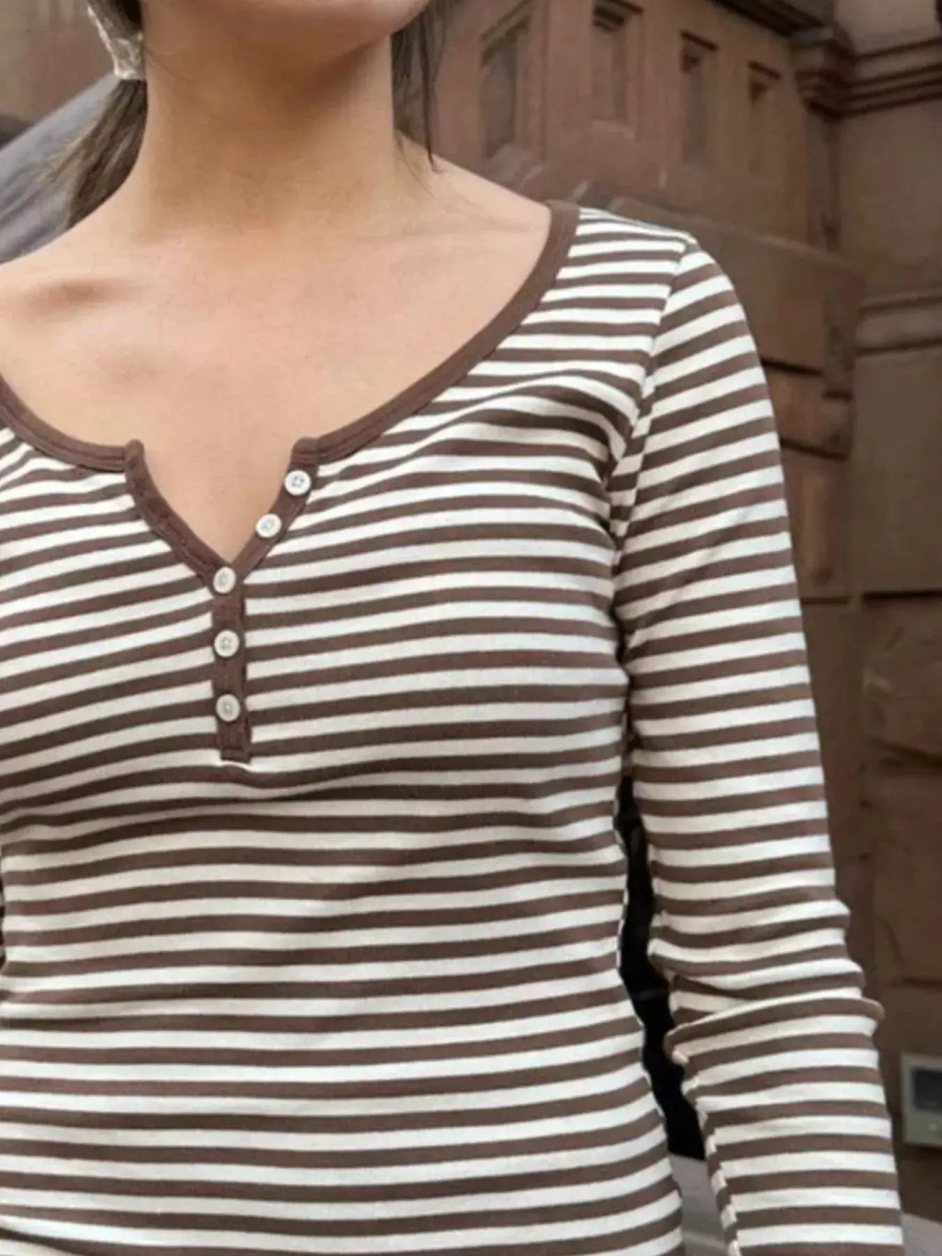 Striped long sleeve Henley T-shirt with buttoned neckline in brown and white, perfect for casual wear.
