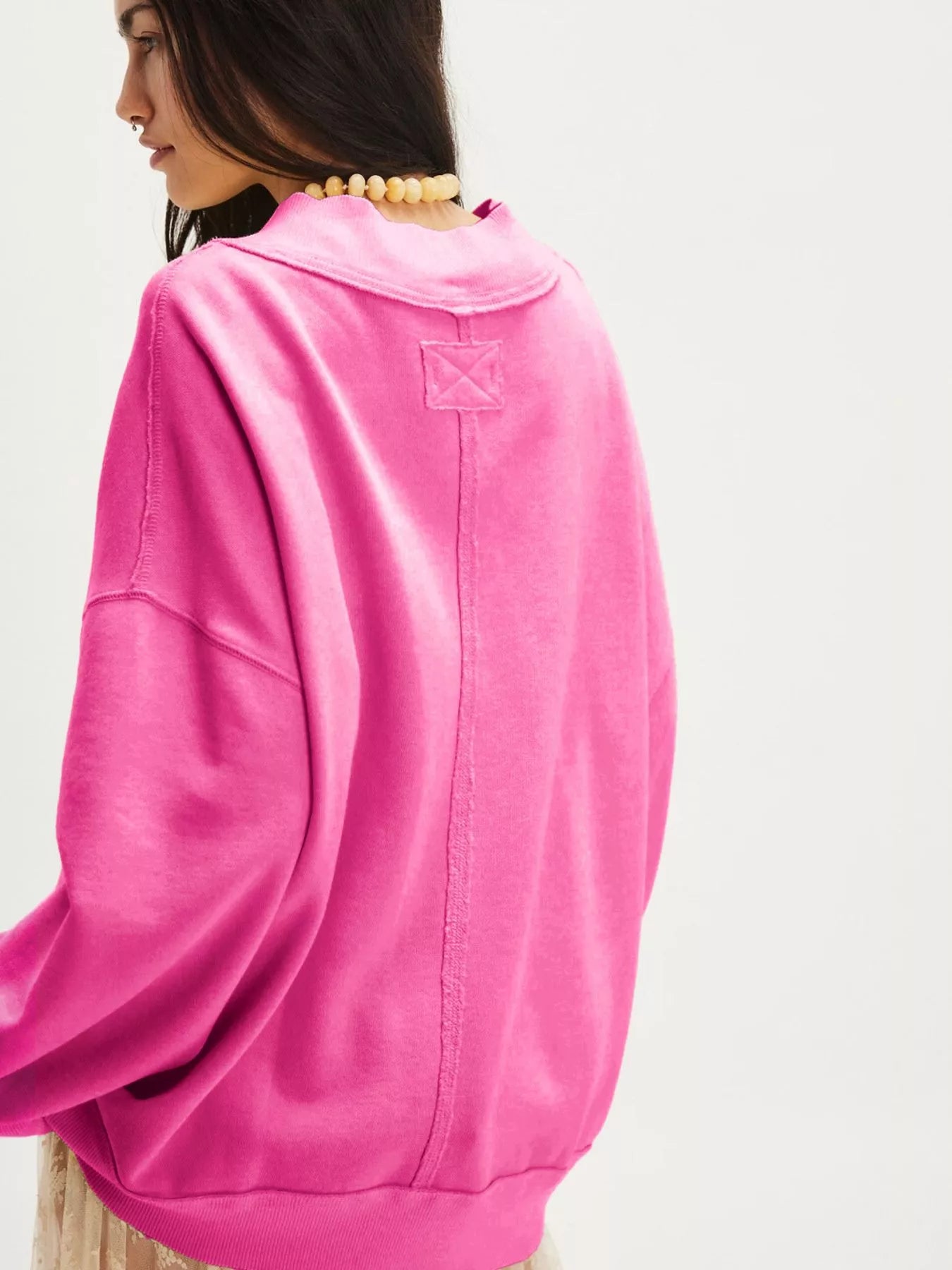 Exposed Seam Dropped Shoulder Sweatshirt in vibrant pink, showcasing a casual and stylish pullover design.