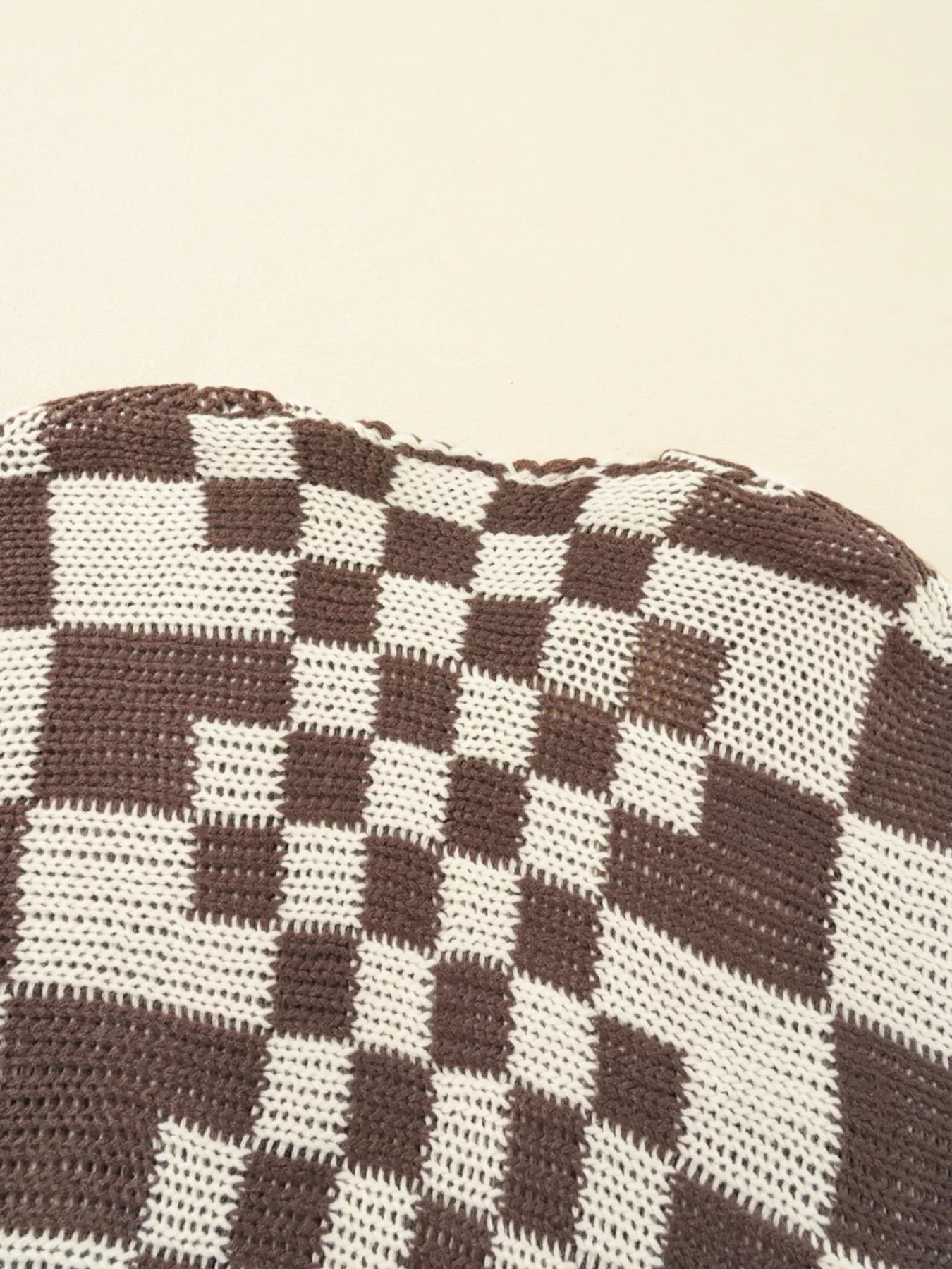 Checkerboard Pattern Sweater Cardigan close-up showcasing its cozy knit texture and design.