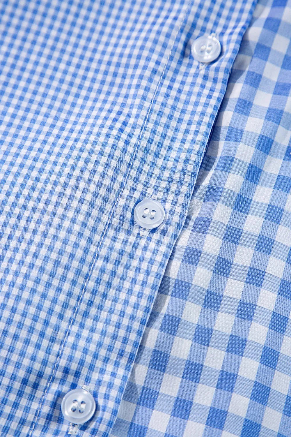 Plaid Button Up Long Sleeve Shirt close-up of blue gingham fabric and buttons