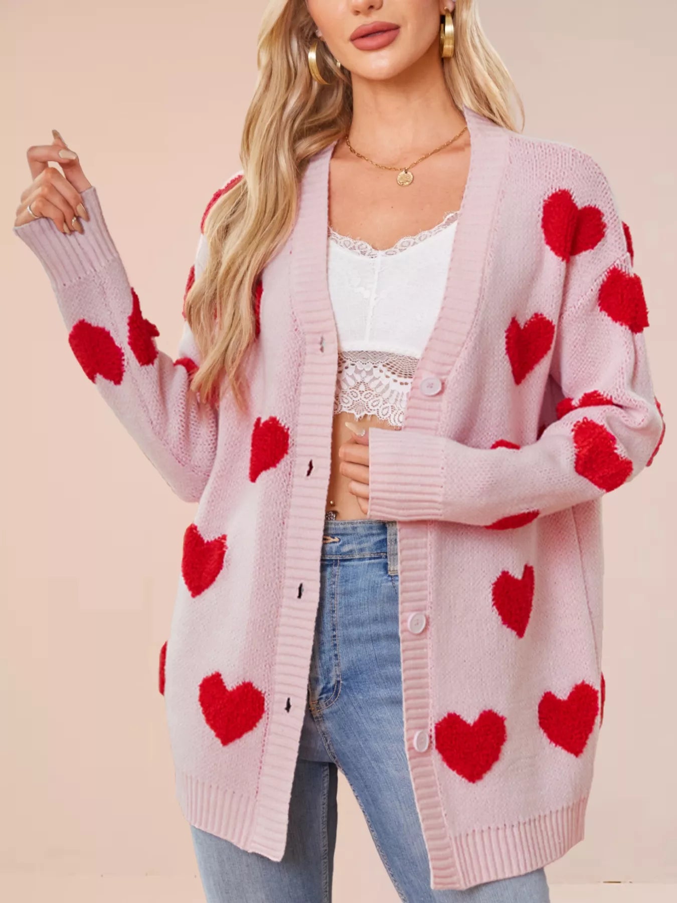Heart Pattern Knit Button Up Cardigan for Women Style featuring red hearts on a pink background, ribbed and buttoned design.