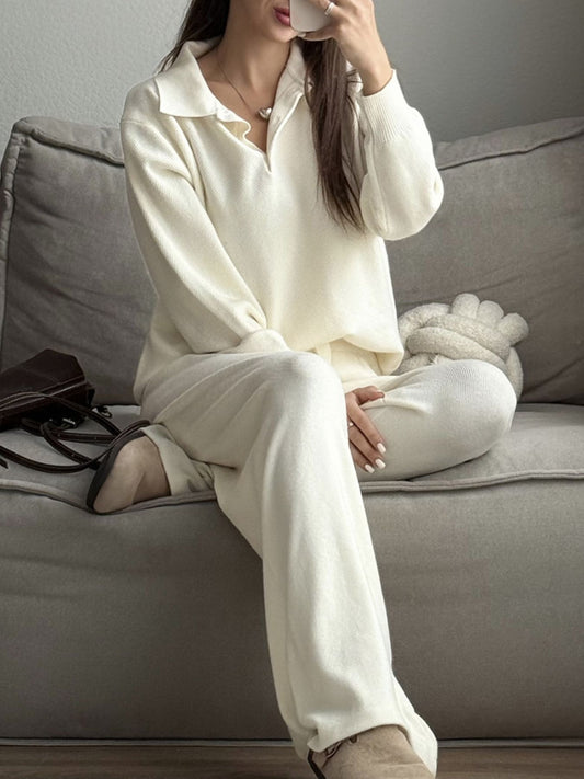 Model wearing a Polo Collar Knit Two Piece Set in cream color, featuring a buttoned top and matching pants, sitting on a couch.