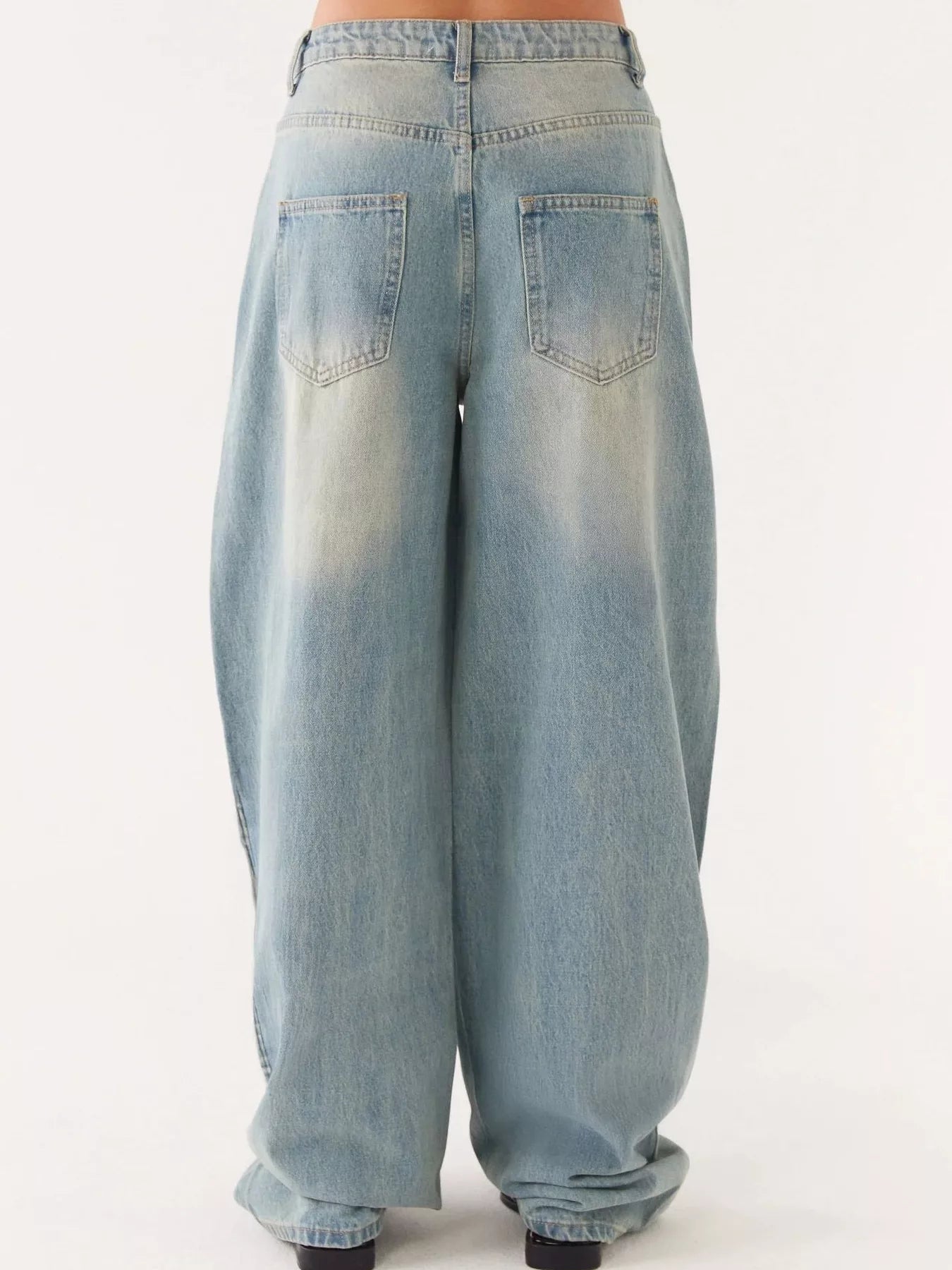 Back view of loose-fit jeans from Button Up Denim Jacket and Jeans Set for modern style.