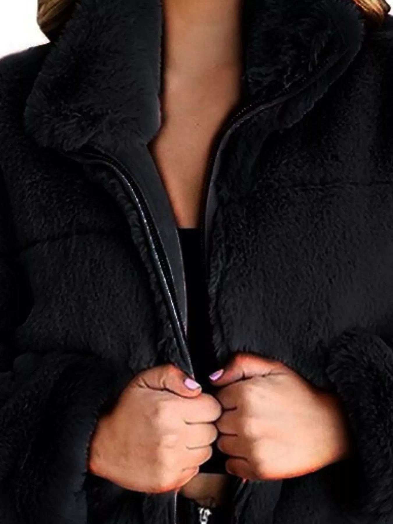 Faux Fur Cropped Zip-Up Jacket featuring a cozy oversized design with a zipper closure, showcasing soft black fabric.