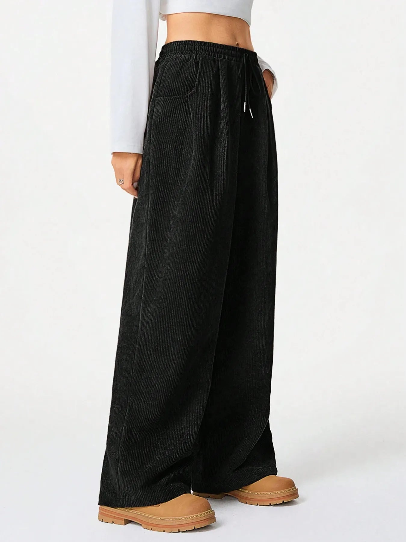 Drawstring Wide Leg Pants displayed on model, showcasing relaxed fit, drawstring detail, and pockets.