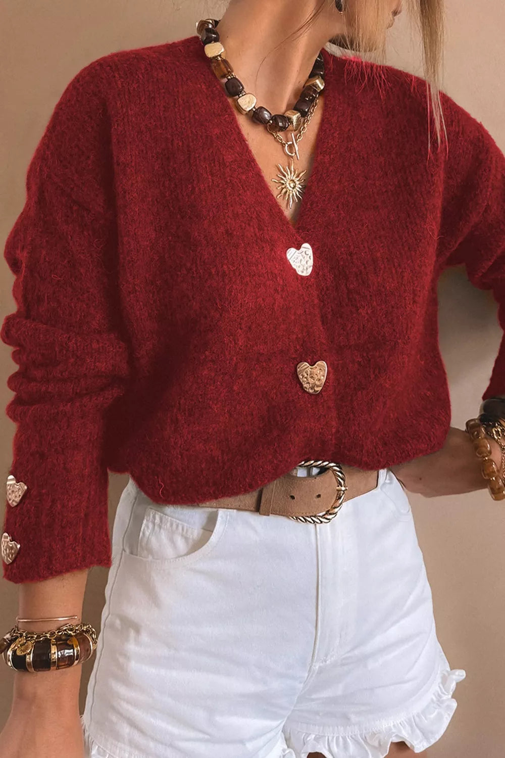 Heart Button Fuzzy Knit Cardigan in red, featuring heart-shaped buttons, paired with white shorts for a cozy everyday look.