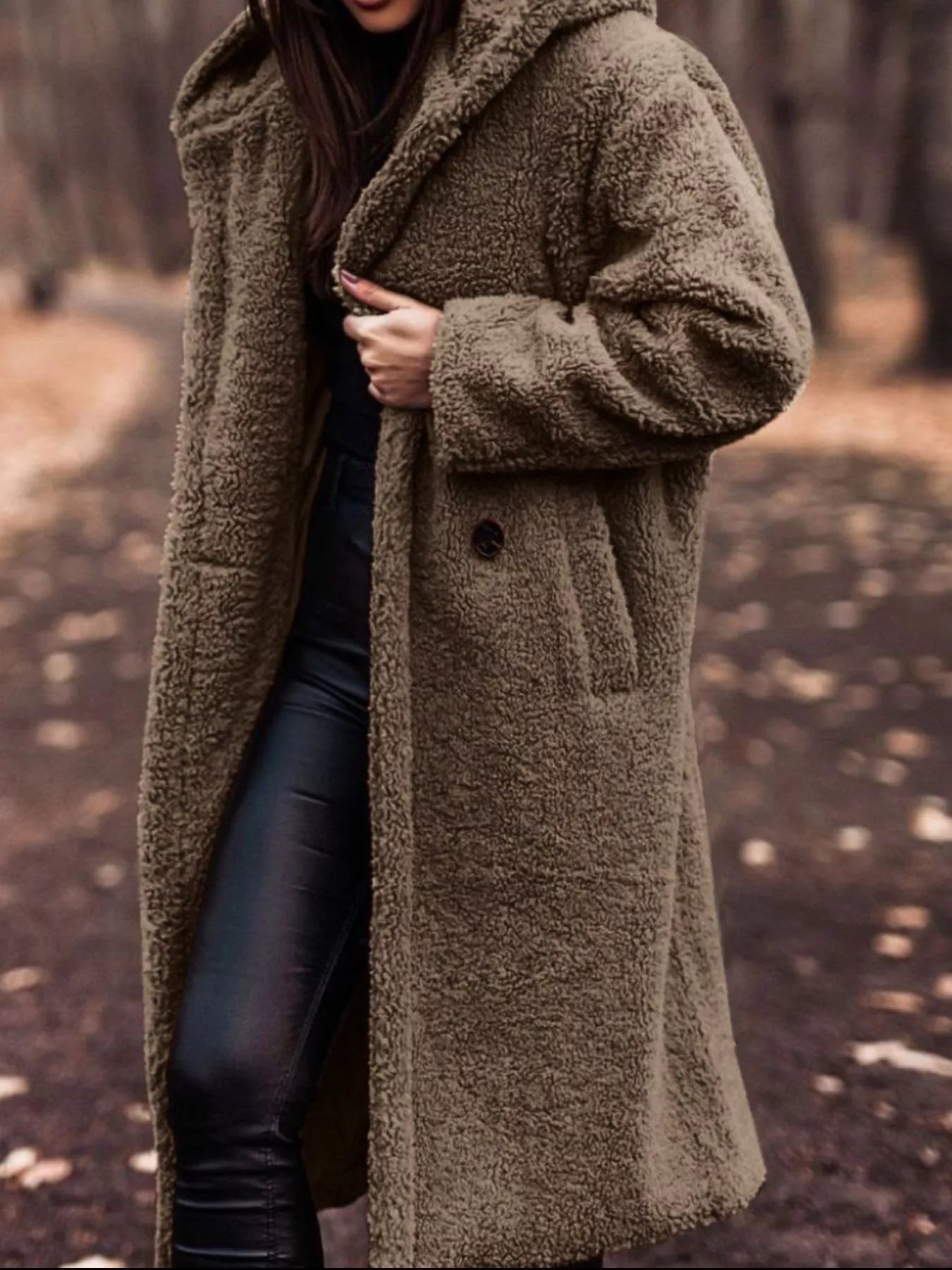 Teddy Bear Hooded Longline Outerwear in a cozy setting, featuring buttoned and pocketed design for stylish warmth.