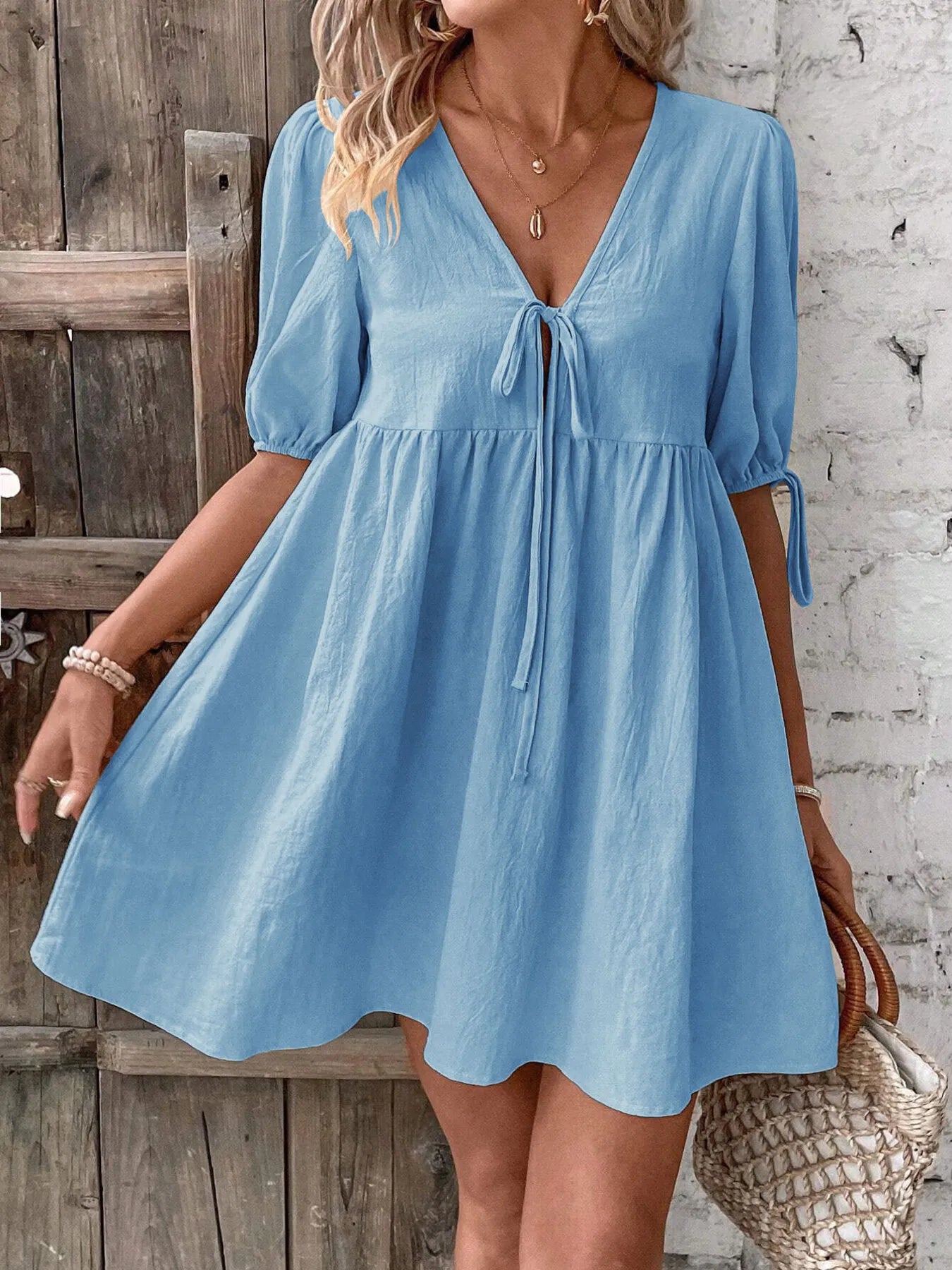 V-Neck Tie-Front Mini Dress with Puff Sleeves in light blue, featuring a front tie and relaxed fit.