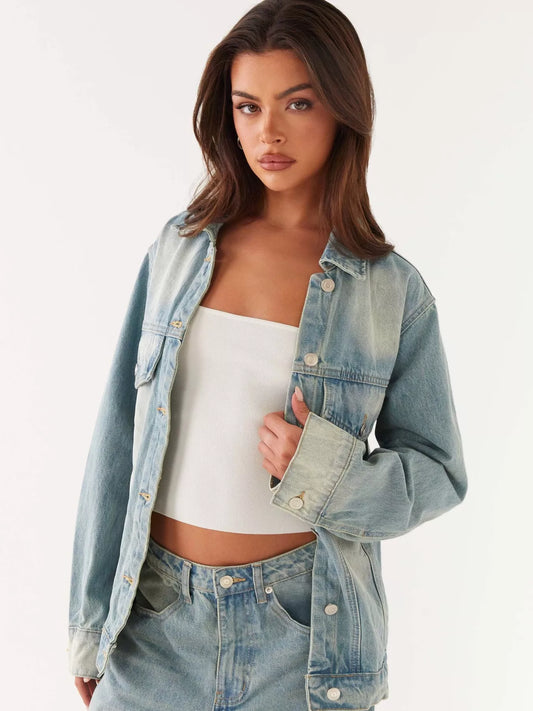 Button Up Denim Jacket and Jeans Set model wearing a stylish denim jacket with a white top.