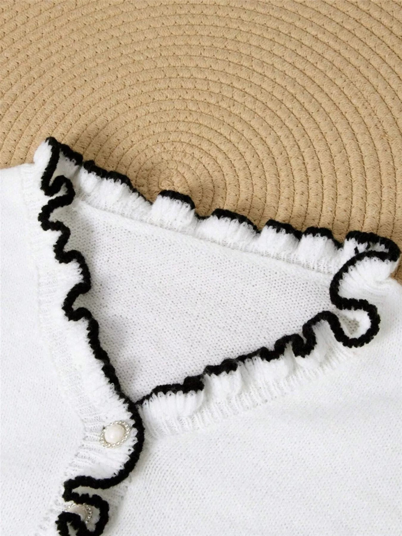 Ruffled Trim Button Front Sweater neckline detail featuring ruffles and button.