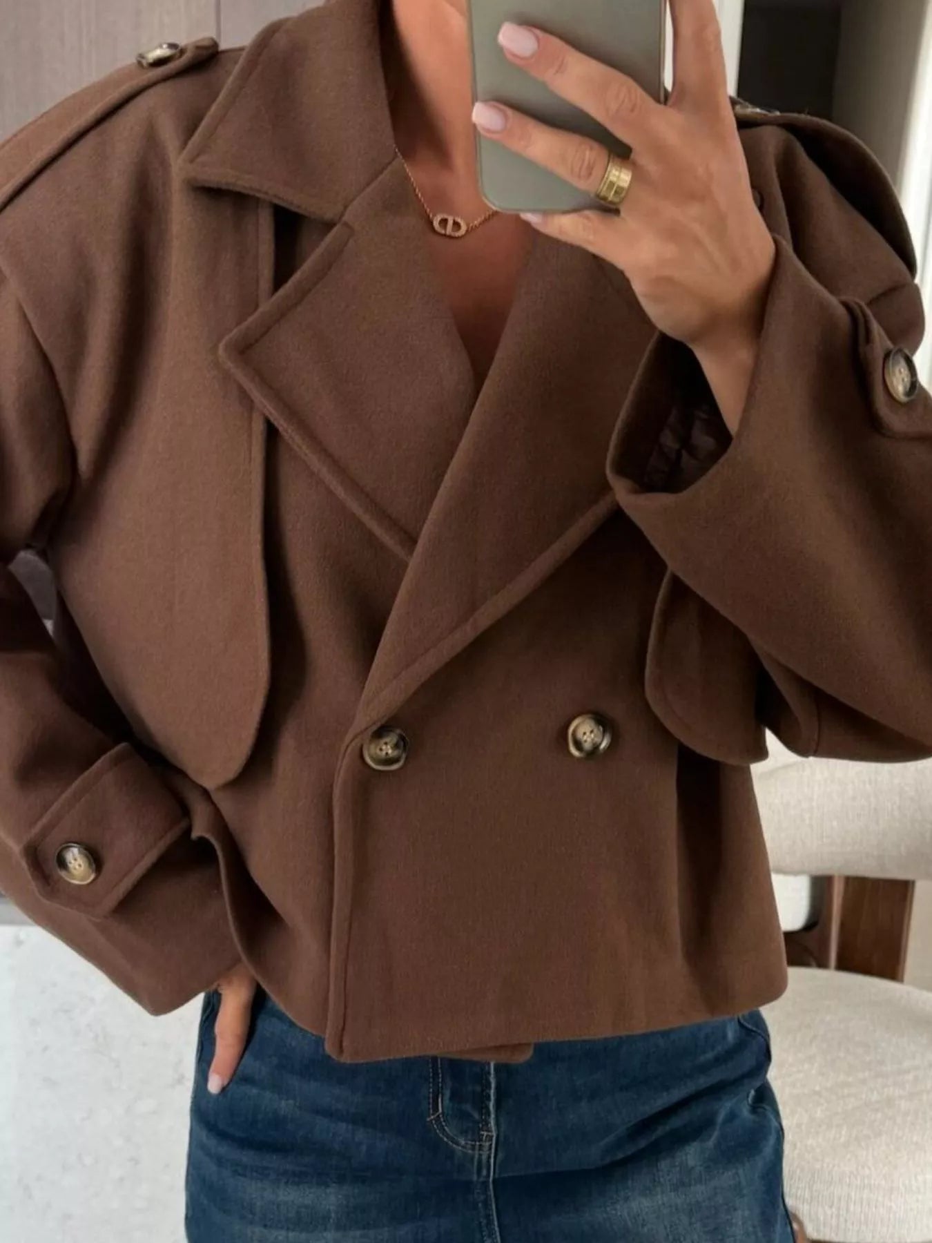 Double-Breasted Cropped Outerwear in brown, featuring buttoned front and stylish layered look.