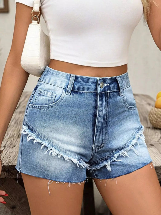 Raw hem denim shorts for women in light blue, styled with a white crop top, perfect for summer casual wear.