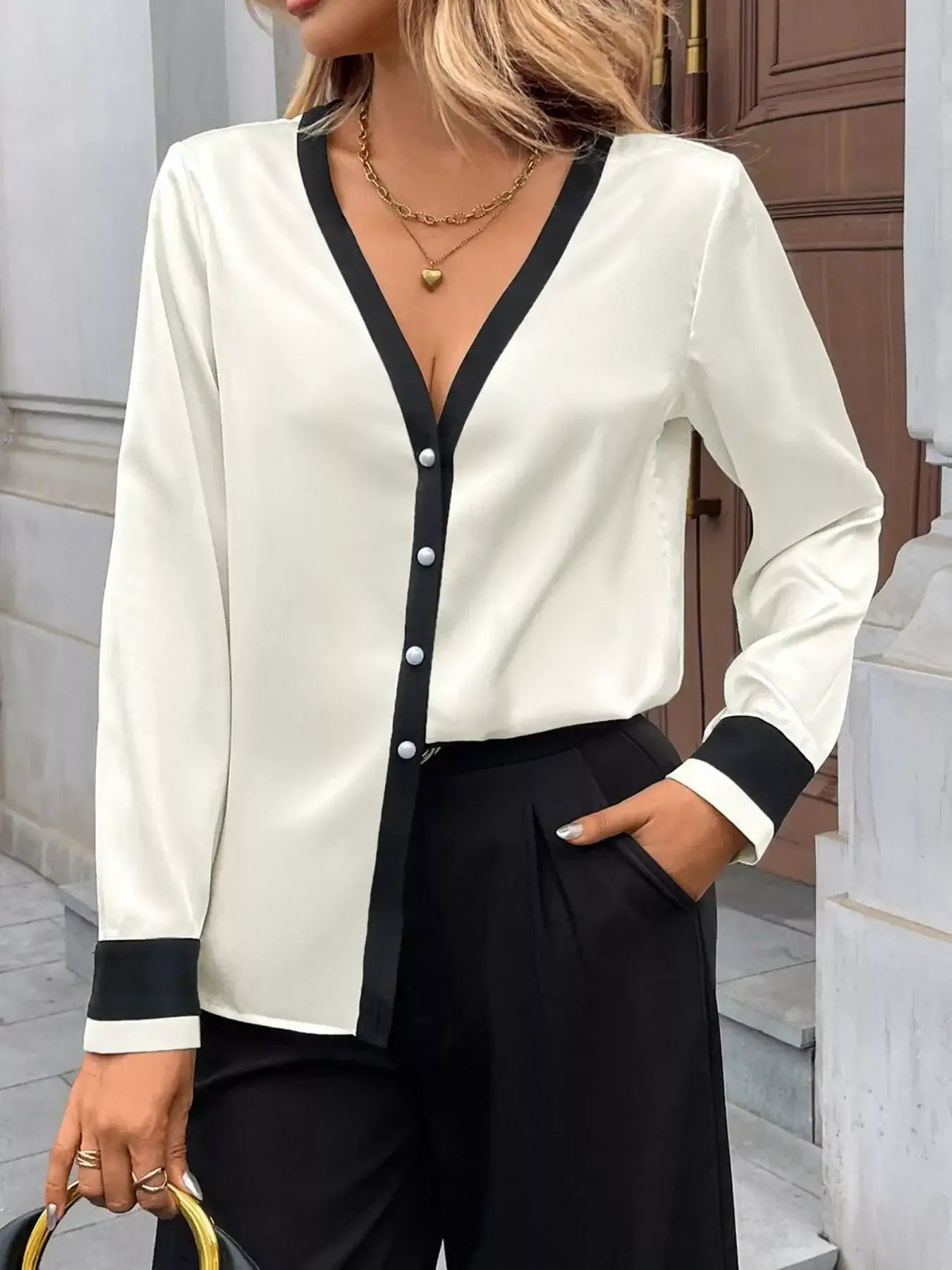 Model wearing Contrast Trim V-Neck Blouse, featuring a V-neckline and buttoned design, styled for elegant everyday looks.