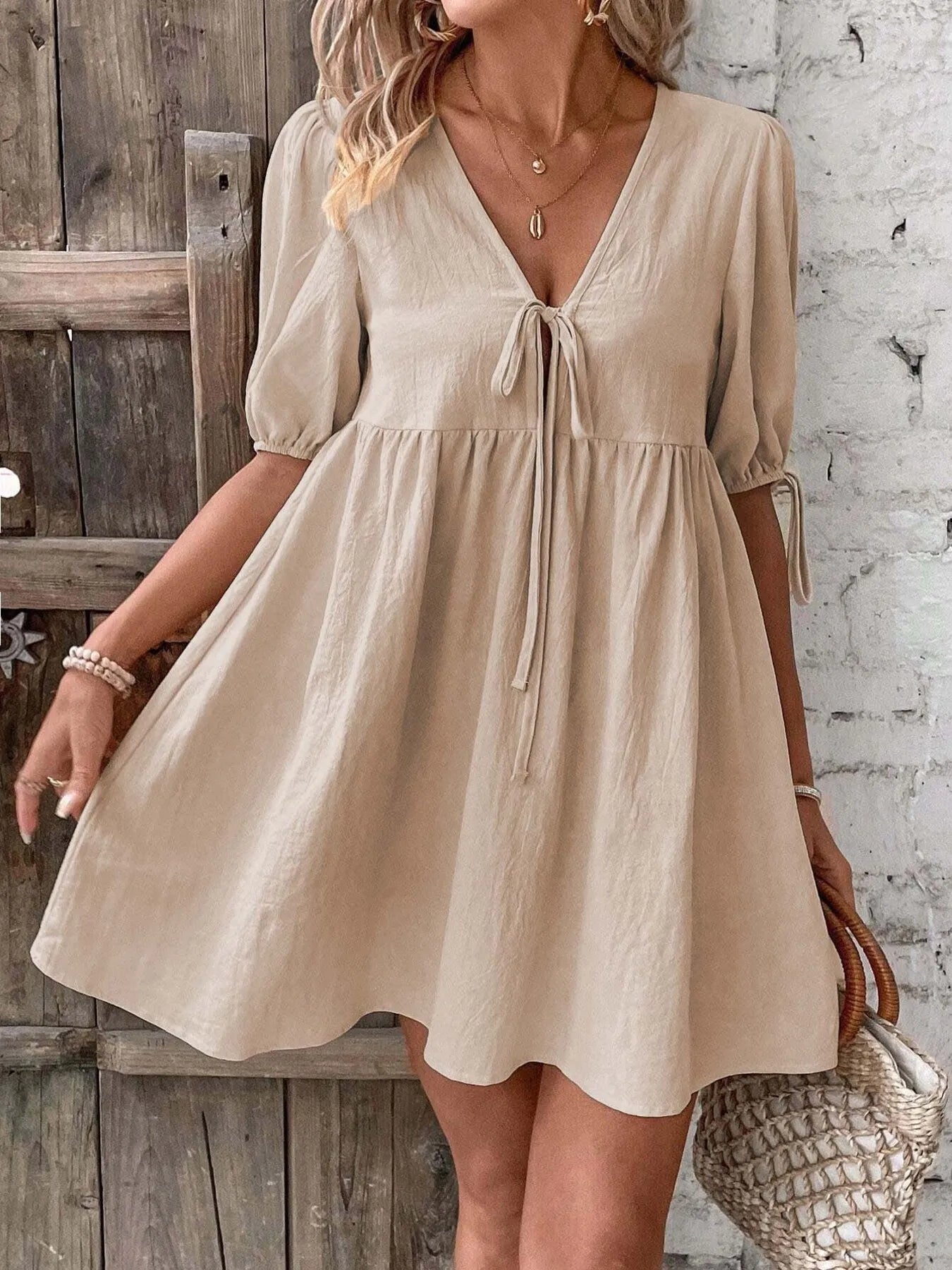 V-Neck Tie-Front Mini Dress with Puff Sleeves in beige, featuring a tied design and relaxed fit.