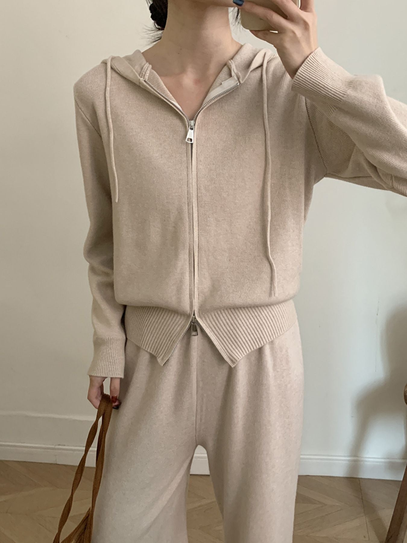 Woman wearing Zip Up Cardigan and Wide Leg Pants Knit Set in beige, showcasing the stylish two-piece outfit.