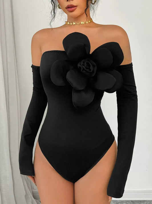 Flower off-shoulder long sleeve bodysuit in black with a floral detail, perfect for elegant styling.