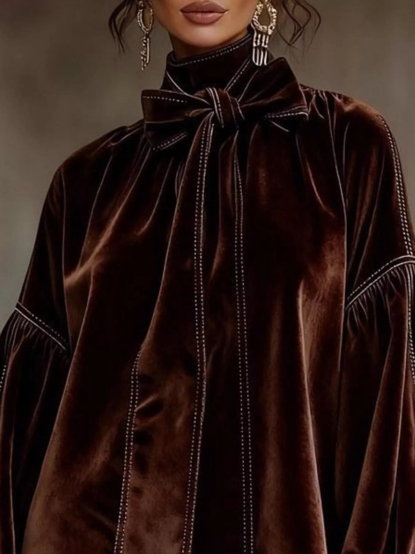 Close-up of a woman wearing a Velvet Bow Tie Long Sleeve Mini Dress featuring a stylish collar and elegant design.