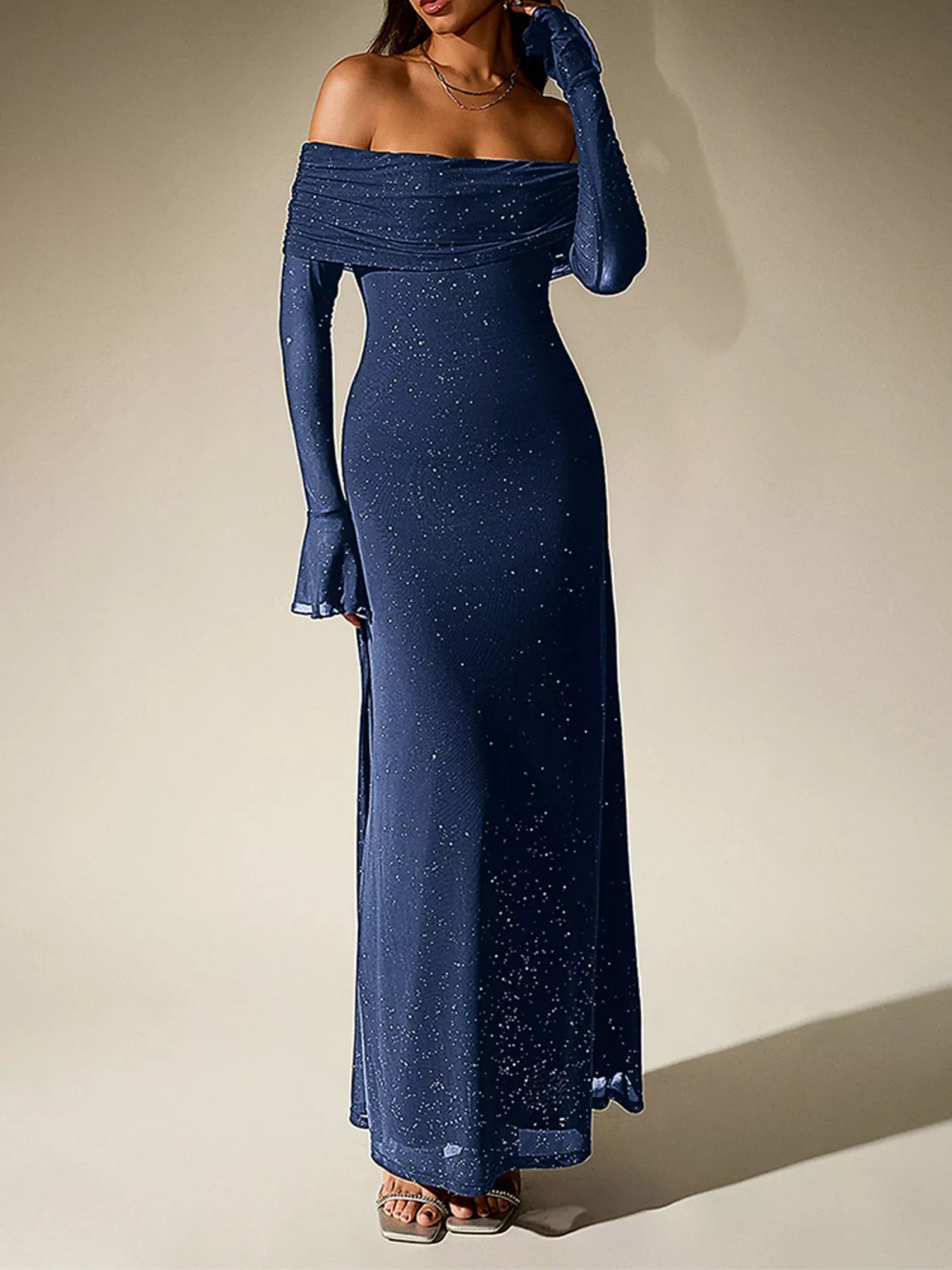 Glitter Off-Shoulder Maxi Dress featuring a fitted silhouette and sparkly detailing for elegant evening looks.
