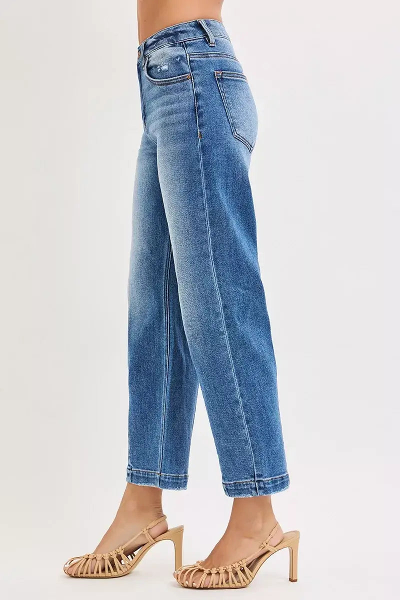RISEN High Rise Crop Boyfriend Tapered Jeans showcasing a relaxed fit and tapered leg with stylish heels.
