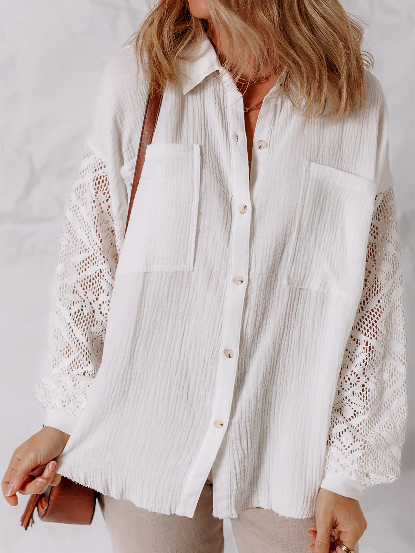 Lace Sleeve Button Down Shirt featuring eyelet sleeves and buttoned front, perfect for an elegant everyday look.