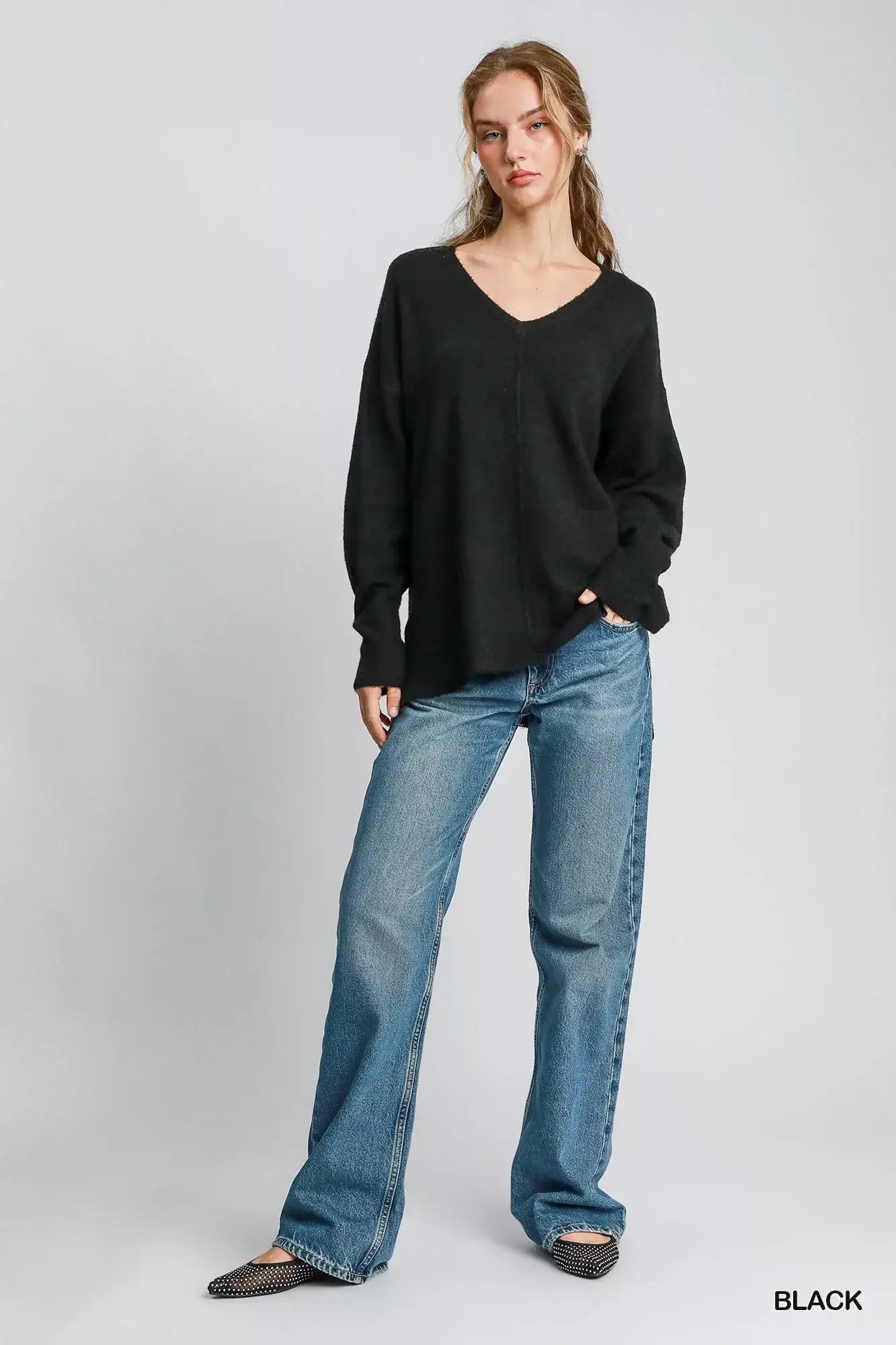 Umgee Wool Blended Pullover Sweater in black, styled with relaxed jeans for a chic winter look.