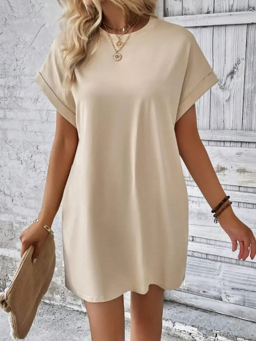 Beige pocketed round neck short sleeve dress, ideal for casual wear, featuring a loose fit and practical pockets.