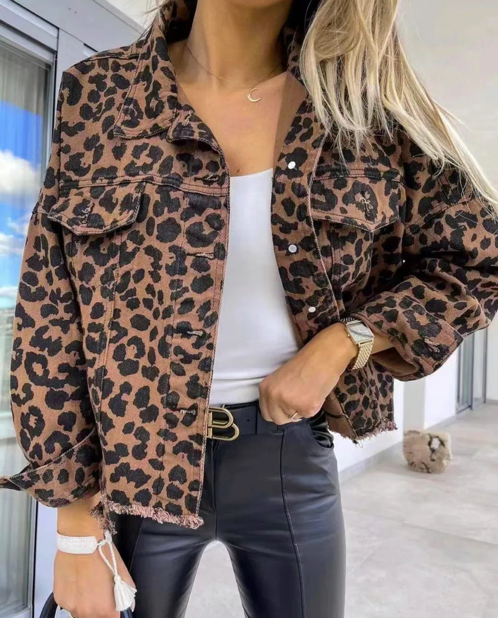 Raw Hem Leopard Collared Neck Denim Jacket styled with a white top and black pants in a modern setting.