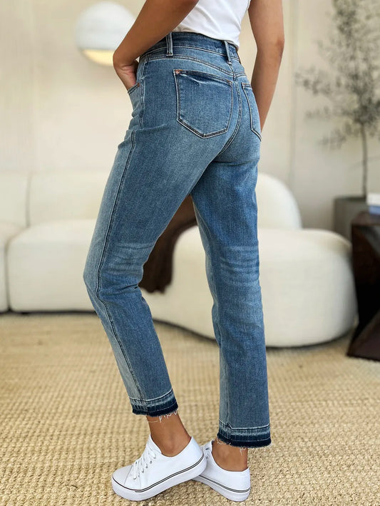 Mid Rise Magic Release Hem Jeans showcased from the back, featuring a structured fit and unique hem detail.