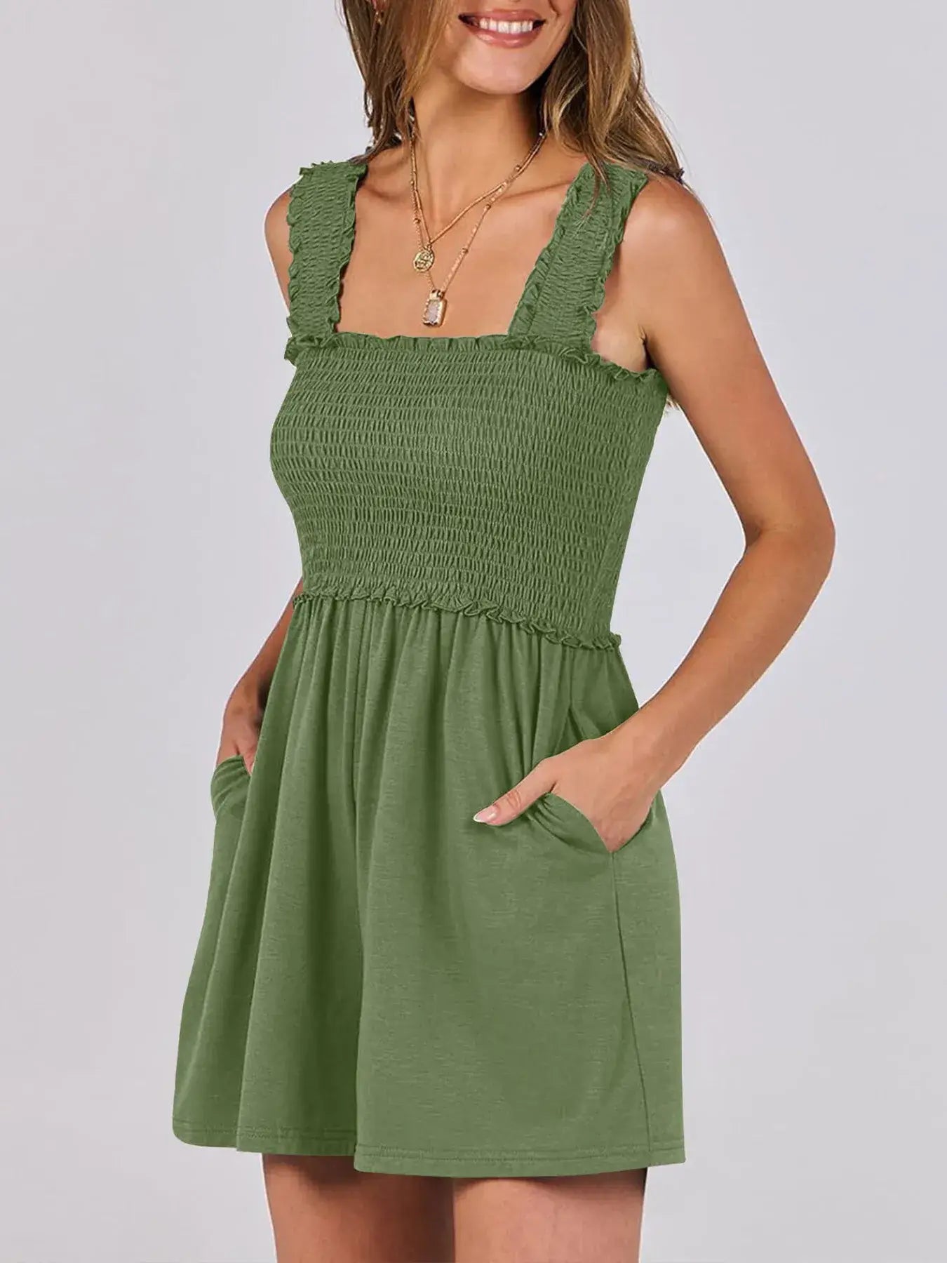Smocked Square Neck Summer Romper in green featuring a smocked bodice, square neckline, and functional pockets.