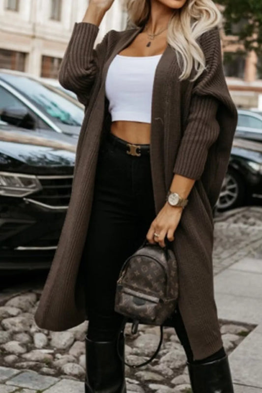 Waffle Knit Open Front Cardigan worn over a white crop top, paired with black jeans and a small backpack.