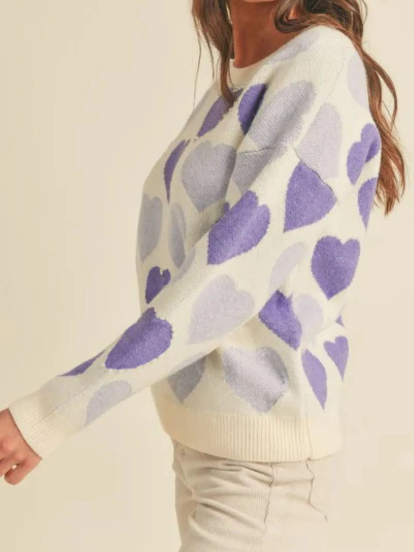 Heart Ribbed Hem Long Sleeve Sweater featuring purple heart pattern and relaxed fit on model.