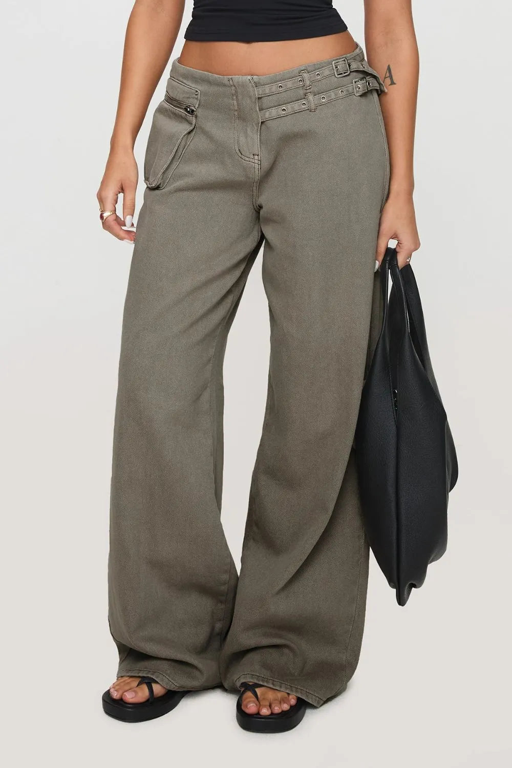 Wide Leg Jeans with Pockets for Comfortable Everyday Wear in olive green paired with a black top and bag.