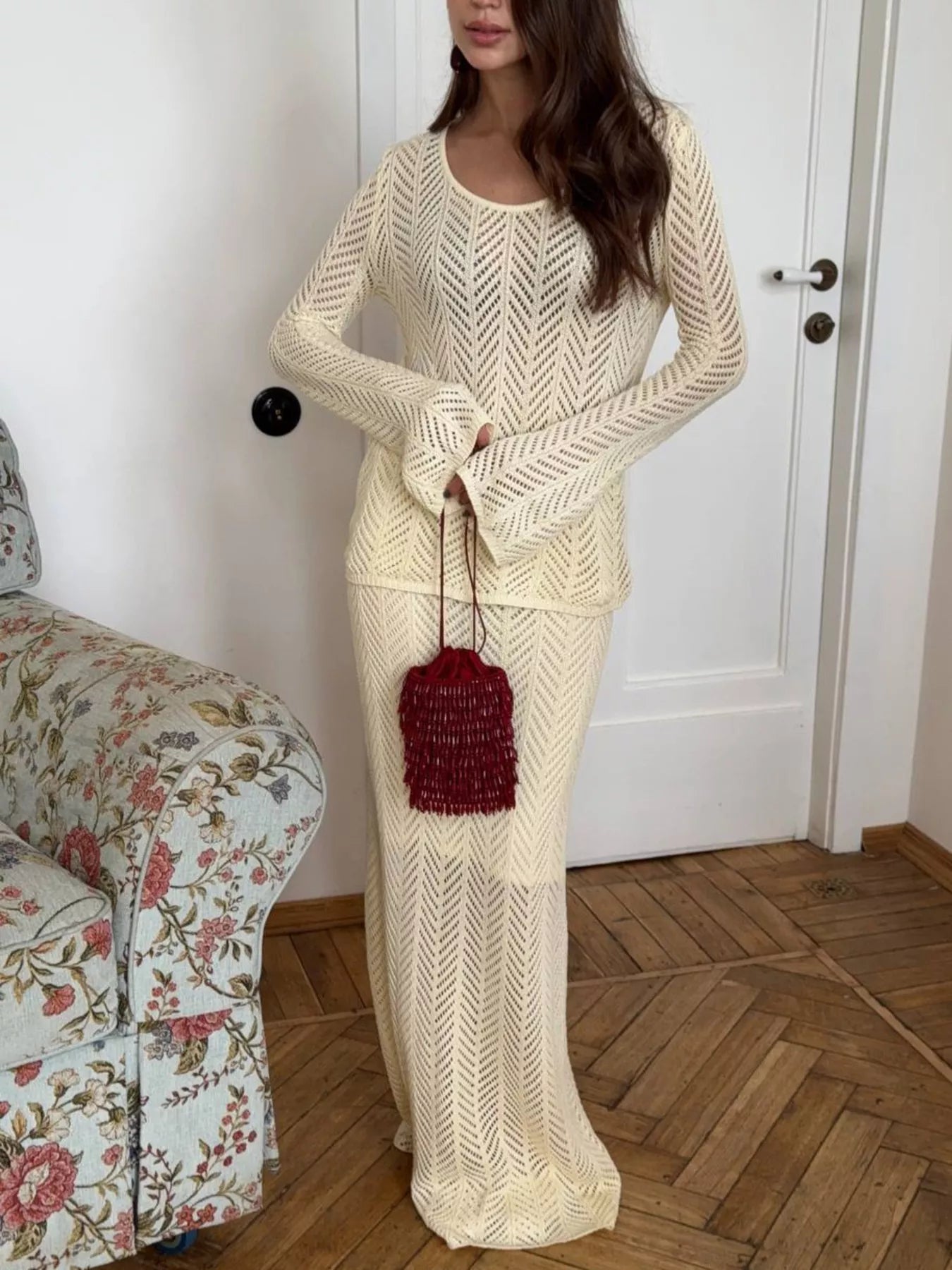Openwork Long Sleeve Knit Top and Skirt Set Elegant Women Outfit in light color with bag.