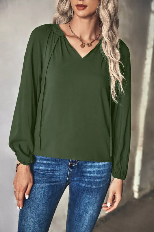 Tie Neck Long Sleeve Blouse – Elegant Office Wear, featuring a green blouse with a stylish V-neck and long sleeves.
