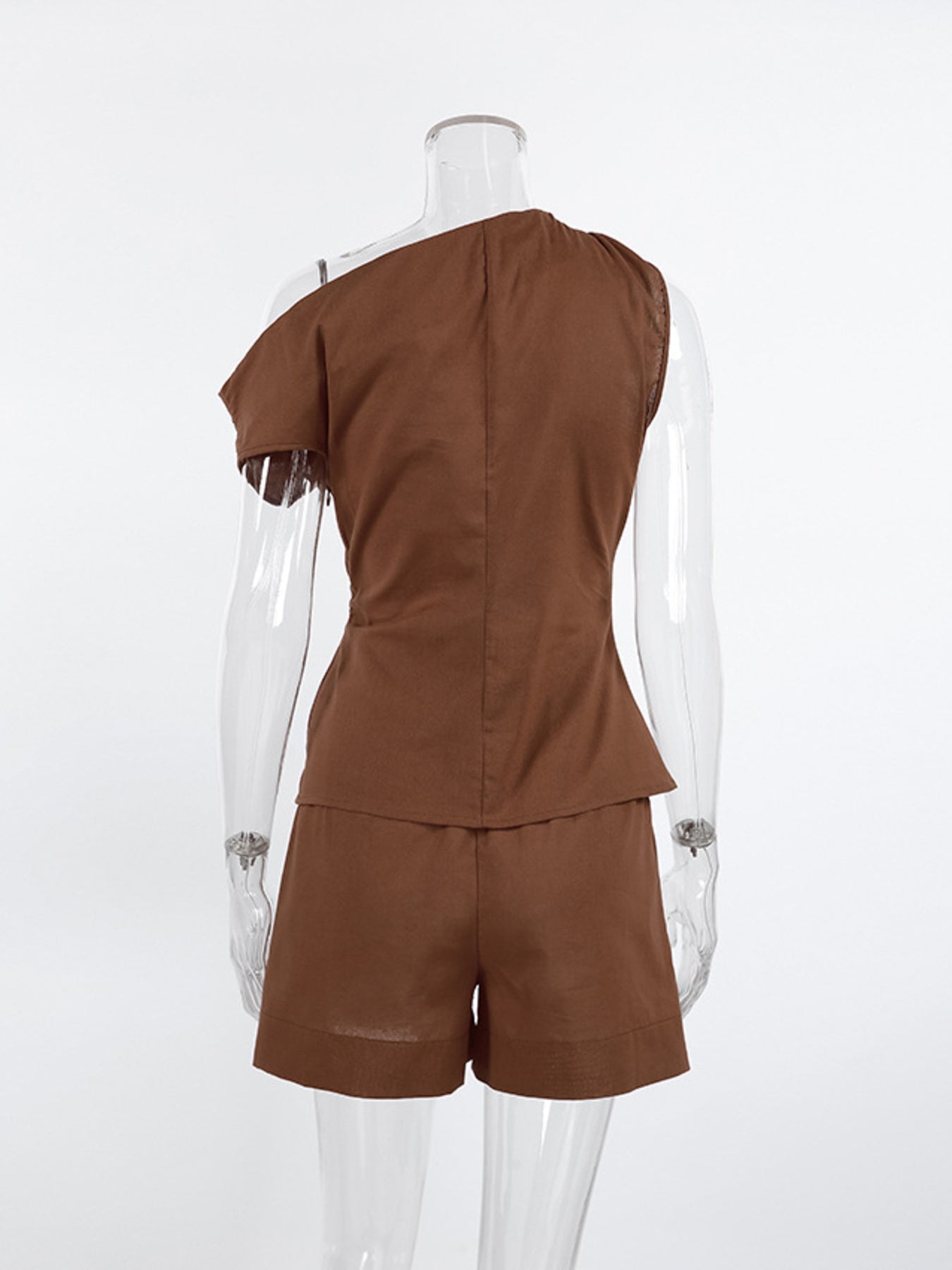 One Shoulder Top and Shorts Set shown from the back, featuring a brown asymmetrical design on a mannequin.