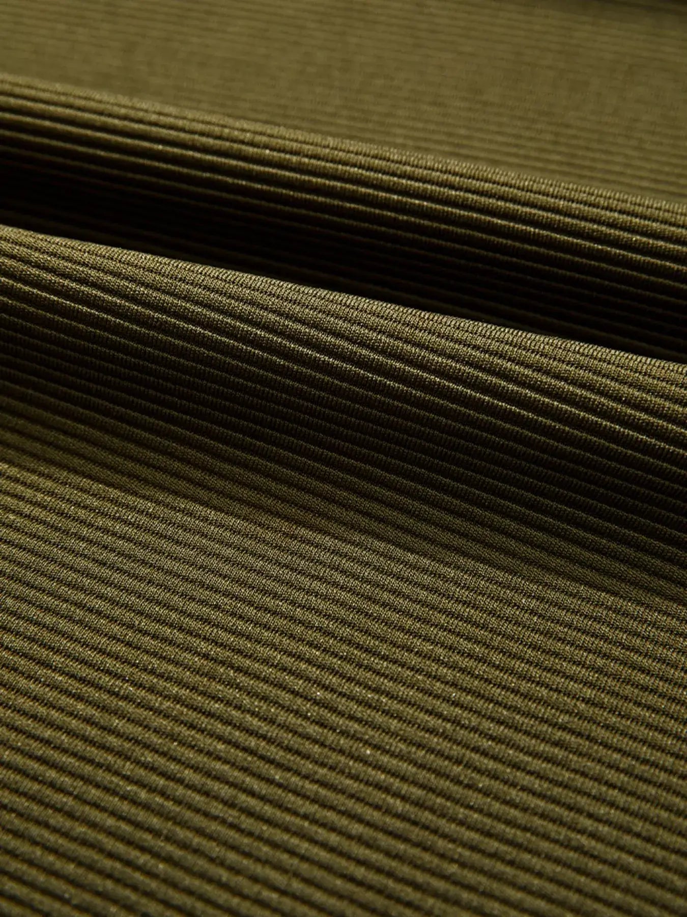 Close-up of ribbed fabric texture used in Ribbed Knit Oversized Sweatshirt, showcasing its modern style and quality.