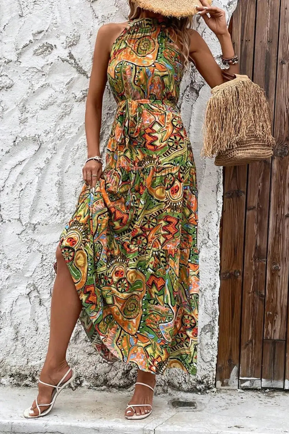 Tied Floral Sleeveless Dress featuring vibrant colors and a stylish pattern perfect for summer occasions.