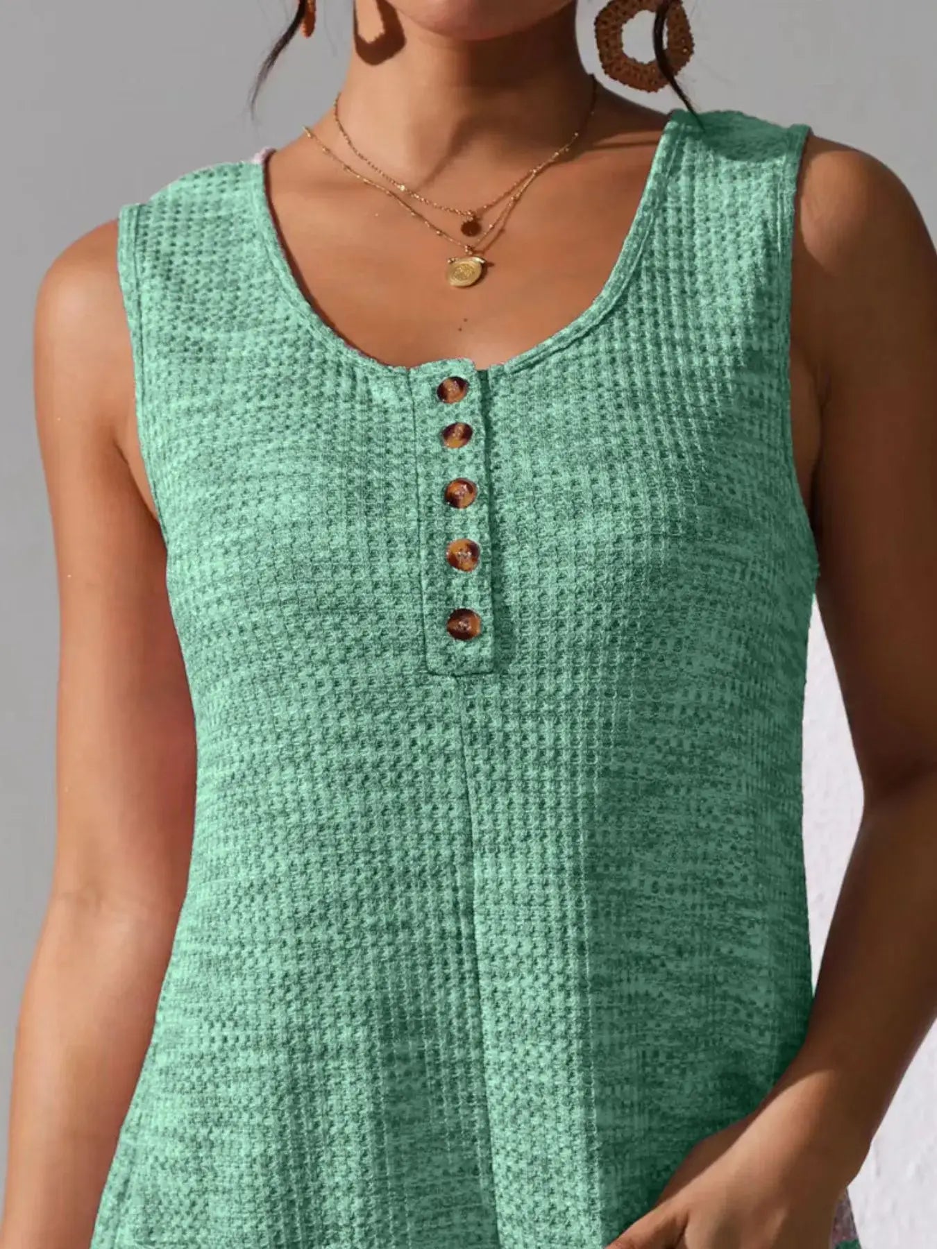 Full Size Button Front Romper with Pockets in green, featuring a button front detail and casual style.