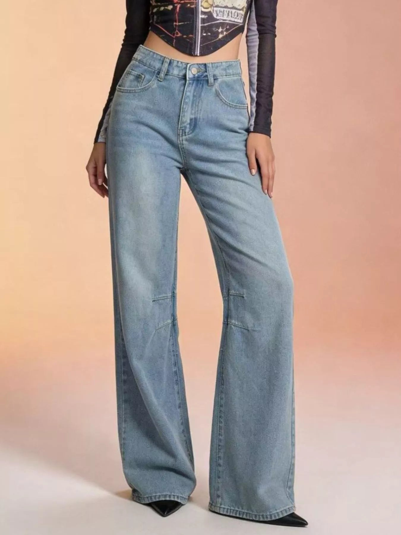 Wide Leg Wash Jeans with buttoned pockets and a stylish design, perfect for casual outfits.